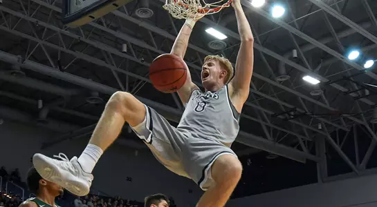 Noah Horchler dunks the basketball