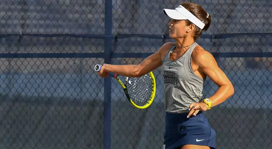 Action shot of Lucia Montano hitting a forehand.