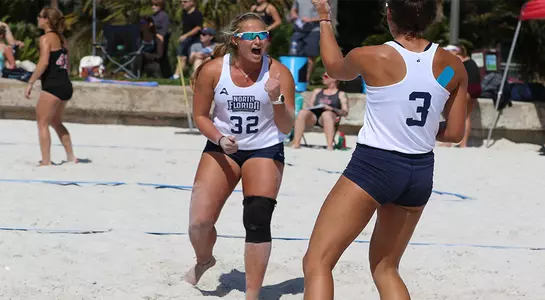 Lauren Galinis and Brittany Pase celebrate a point.
