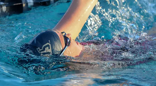UNF swimmer Anne Fletcher completing a backstroke swim.