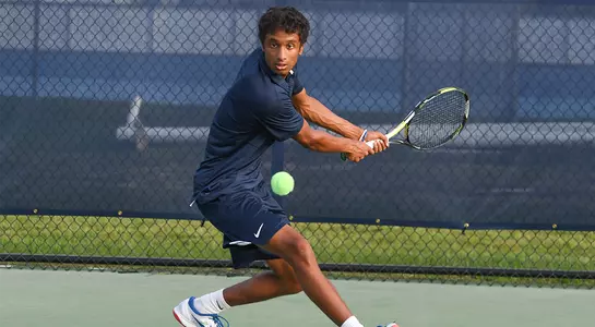 Sahil Deshmukh action shot two-handed backhand at the UNF Tennis Complex.