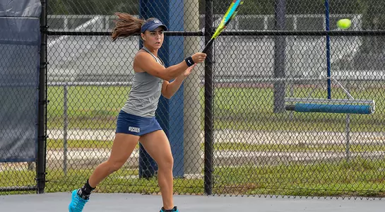 Action shot of Ana Paula Melilo hitting a forehand.