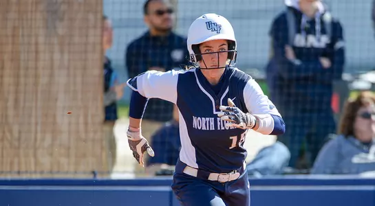 Megan Woodson runs to first base against Notre Dame.