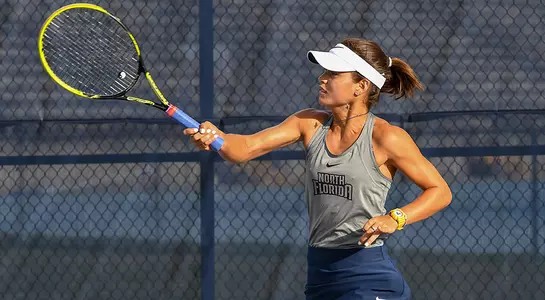 Lucia Montano hits the tennis ball with her forehand.