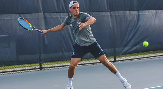 Dominik Barton about to hit a forehand