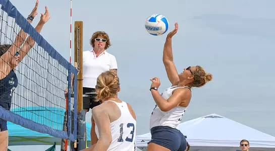 Nicole DeBolt advances ball over the net for UNF