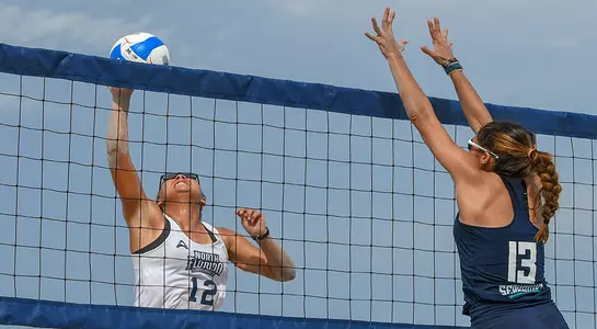 Nicole DeBolt challenges opponent at net