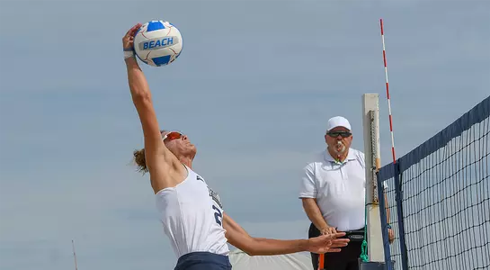Antonia Harrison hits ball over net for Ospreys