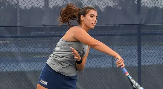 Valentina Mariotto serves at the UNF tennis complex.