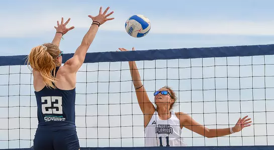 Madilyn McCarty challenges player at net at UNF Invitational