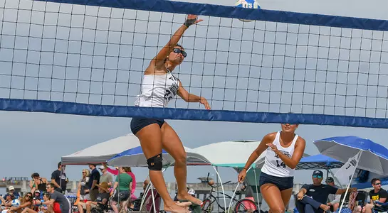Marisa Rogers advances ball over net for Ospreys