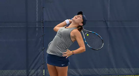 Constanza Gorches serves the tennis ball.