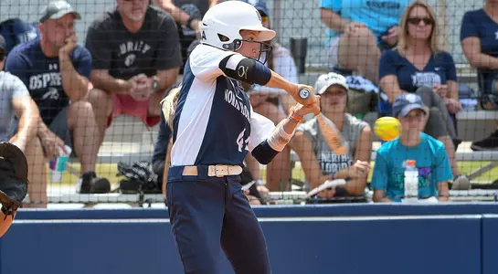 Softball player Taylor Engman hits the ball against KSU.