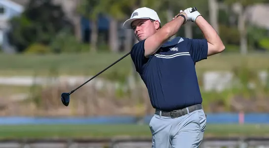 Andrew Alligood follows through on a drive on the tee box