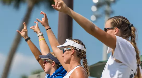 Team photo of UNF BV Players on the sidelines during a match.