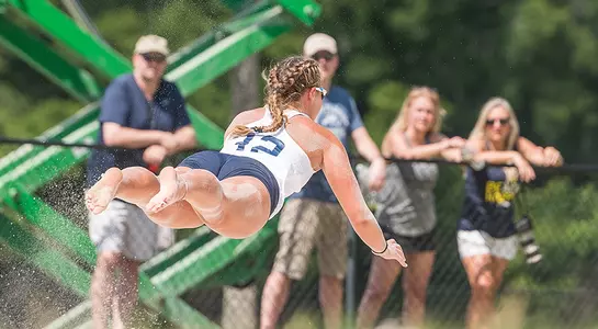 Lauren Galinis lays out to dig out the ball.