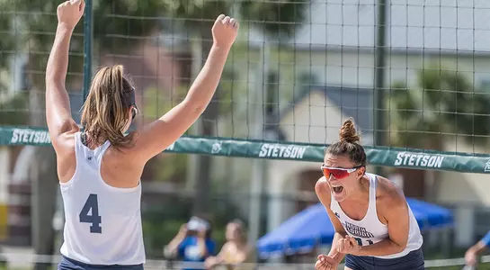 Antonia Harrison and Carolyn Cain celebrate a point.