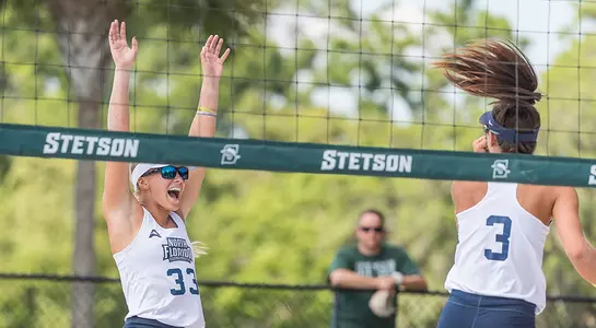 Brittany Pase and Chaney Howard celebrate a point.
