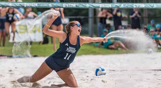 Madilyn McCarty throws sand in celebrating a point.