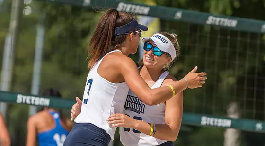 Brittany Pase and Chaney Howard hug after a point.