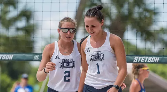 Dana Roskic and Callie Workman talk after a point.