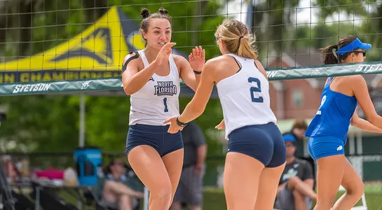 Dana Roskic and Callie Workman celebrate a point.