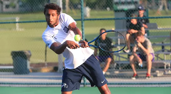 Sahil Deshmukh follows through on a two-hand backhand.