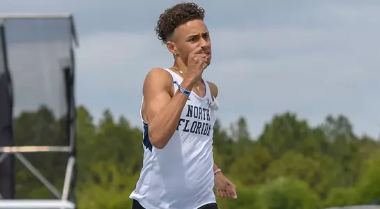 Jared Vazquez pumps his arms as he races towards the finish line