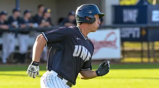 baseball player Chris Berry running rounding first base