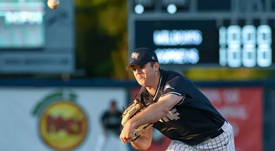 baseball player Hunter Bowling pitching end of release