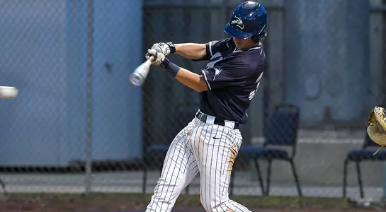 baseball player Tanner Clark mid swing