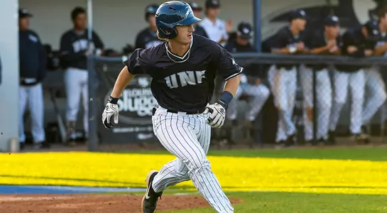 baseball player Tanner Clark running to first base