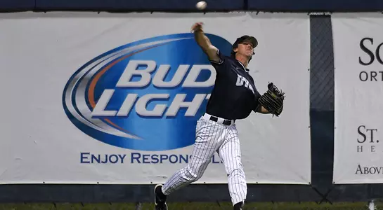 baseball player Blake Marabell throwing ball from left field