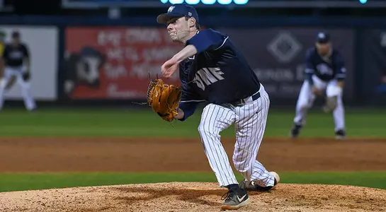 baseball player Eddie Miller pitching after release