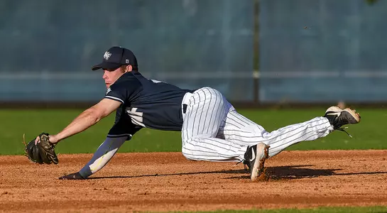 baseball player Jay Prather diving for a ball at second base