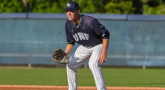 baseball player Alex Reynolds waiting for a ball at first base