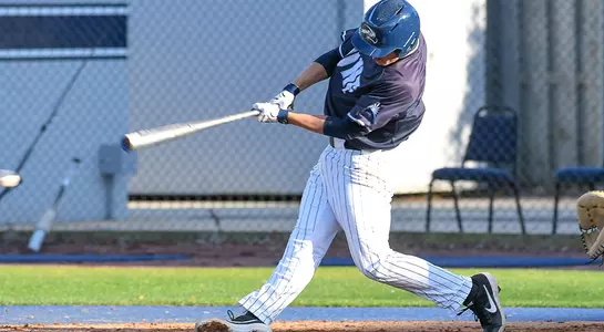 baseball player Alex Reynolds swinging at a baseball