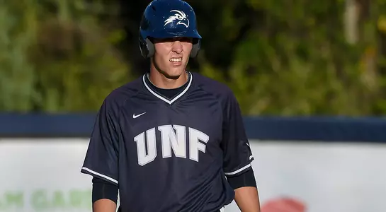 baseball player Alex Reynolds running standing at first base