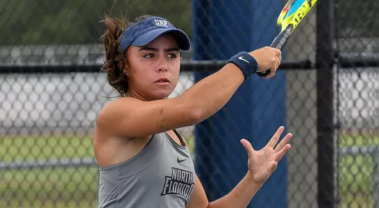 Ana Paula Melilo follows through on her forehand on the tennis court.