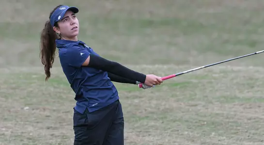Liss Davalos hits a drive off the tee box