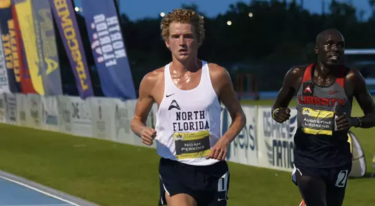 Noah Perkins crosses the finish line of the 10,000 meter at the ASUN Championship