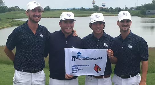 Men's golf seniors Travis Trace, Andrew Alligood, Jordan Batchelor and Philip Knowles hold a flag from the green at the Louisville regional to celebrate advancing to the NCAA Championship