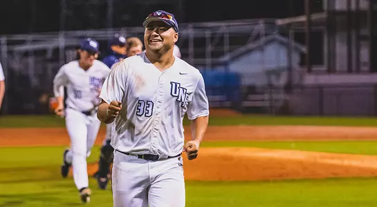 David Maberry runs off the field smiling.