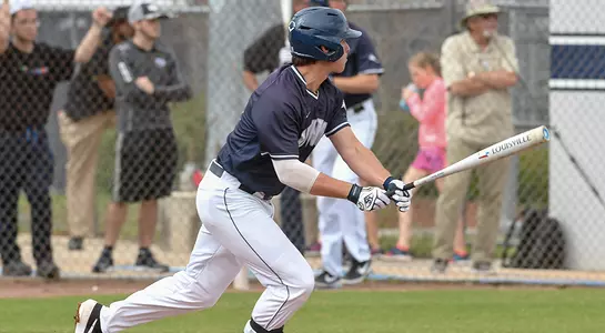 UNF player Chris Berry watches the ball after making contact with it.