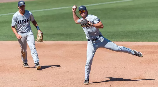 Infielder Tanner May winds up before delivering a throw across the infield.