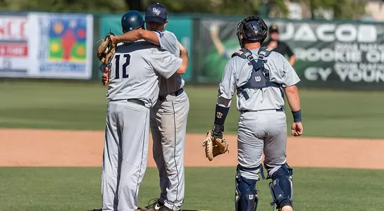 Pitcher Brad Deppermann hugs head coach Tim Parenton