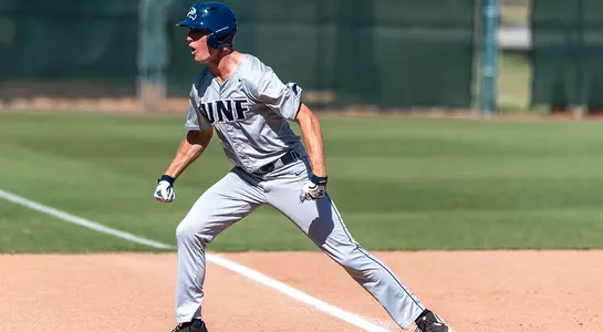 Baseball player Tanner Murphy celebrates a hit a third base.