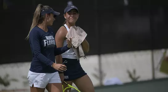 Coach Cobra and Ana Paula Melilo talk during the ASUN Tennis Championships (Phelan M. Ebenhack for the ASUN Conference)