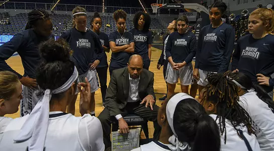 Head Coach Darrick Gibbs coaches the women's basketball team during a timeout at UNF Arena.