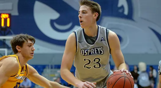 Carter Hendricksen dribbles the basketball